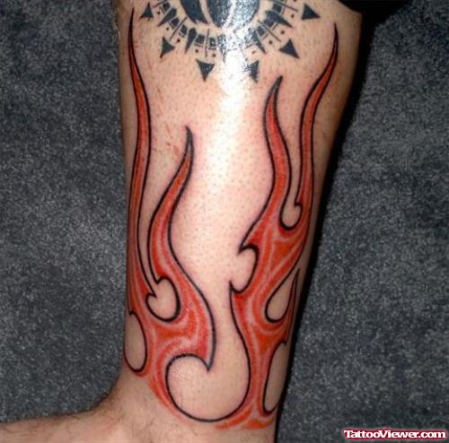 Red Ink Fire And Flame Tattoo On Leg