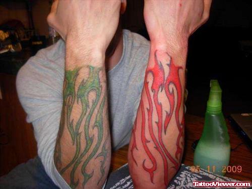 Green And Red Ink Fire n Flame Tattoos On Both Arms