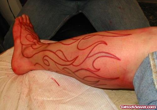 Tribal Fire And Flame Tattoo On Leg