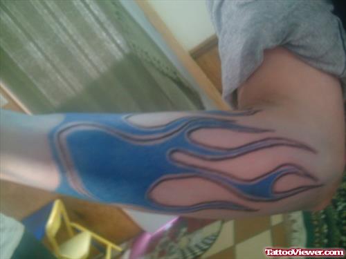 Blue Ink Fire n Flame Tattoo On Left Arm