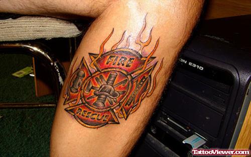 Flaming Firefighter Logo Tattoo On Leg