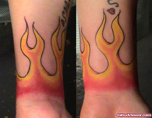 Colored Fire And Flame Tattoos On Wrists