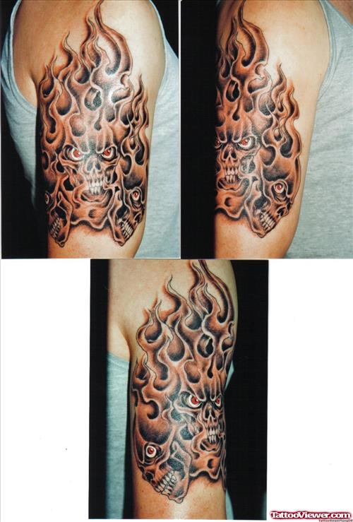 Flaming Skulls Grey Ink Tattoo On Half Sleeve