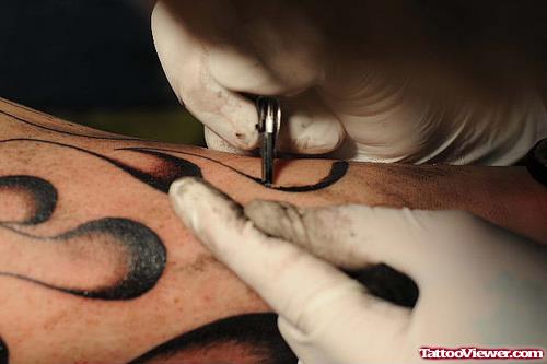 Black Ink Flames Tattoo In Process