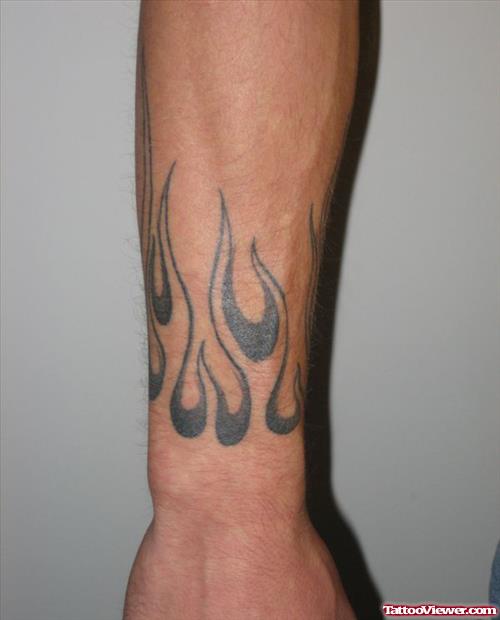 Awesome Grey Ink Fire And Flame Tattoo On Arm