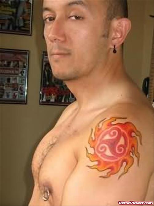 A Fire and Flame Tattoo On Shoulder