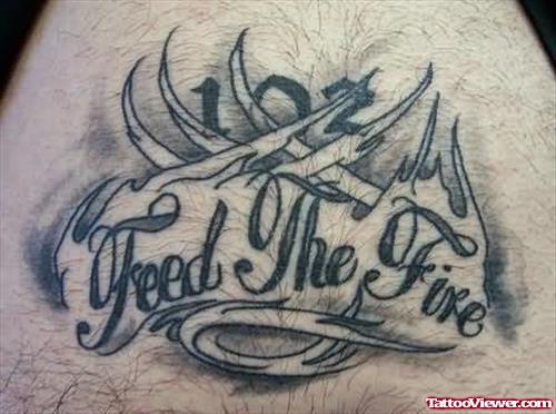 Fire Words And Flame Tattoo On Back