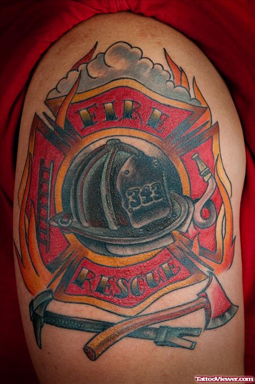 Awesome Colored Flaming Cross Firefighter Tattoo On Shoulder