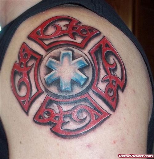 Red Ink Tribal Firefighter Tattoo On Shoulder
