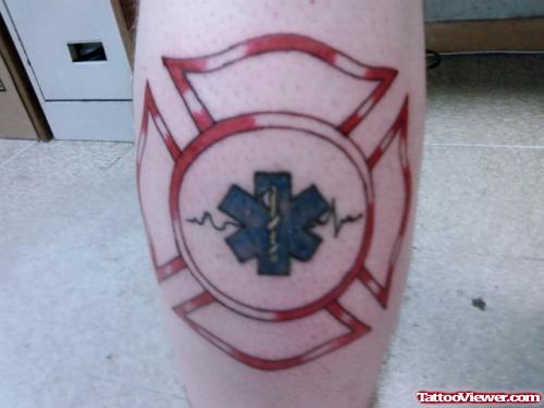 Firefighter Cross Tattoo On Back Leg