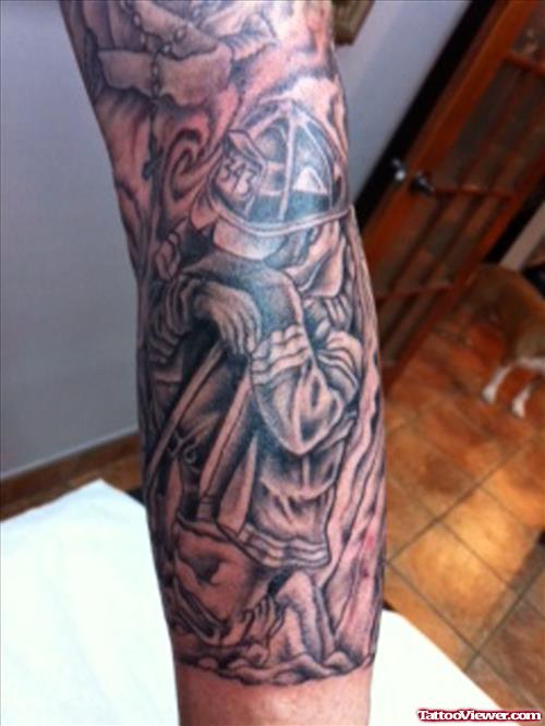 Grey Ink Firefighter Tattoo On Left Sleeve