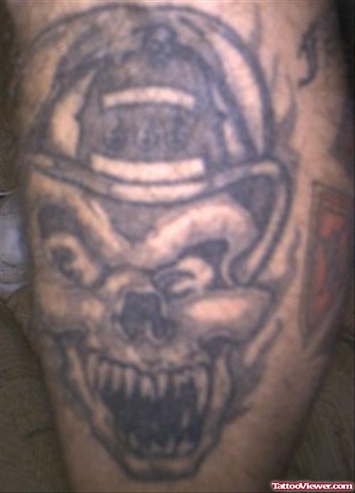 Grey Ink Skull Firefighter Tattoo