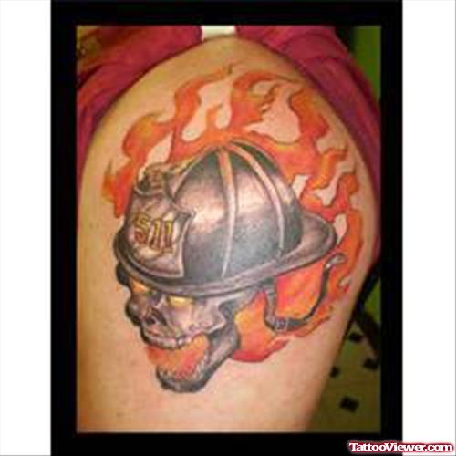 Flaming Firefighter Helmet Tattoo On Shoulder