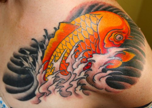 Colored Ink Fish Tattoo On Man Left Shoulder