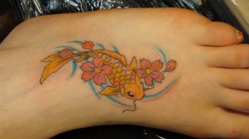 Color Flowers And Fish Tattoo On Left Foot