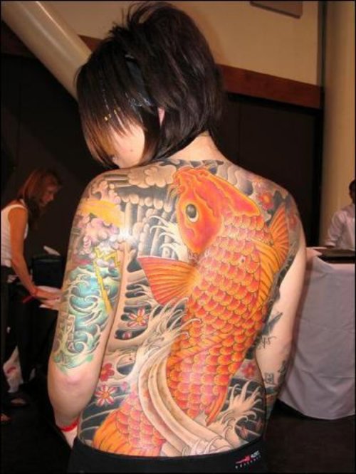 Attractive Fish Tattoo On Girl Back Body