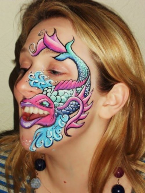 Colored Fish Tattoo On Girl Face
