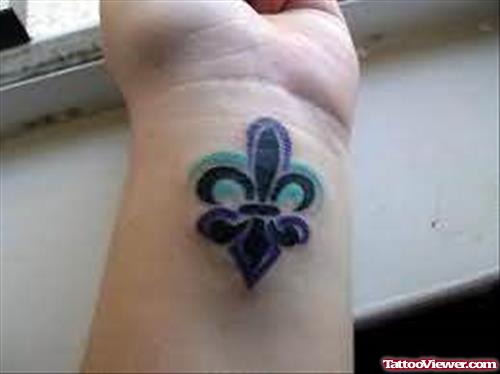 Fleur De Lis Blue Tattoo On Wrist