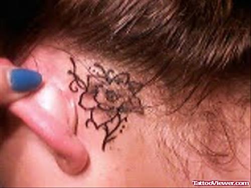 Amazing Tiny flower Tattoo On Back Ear