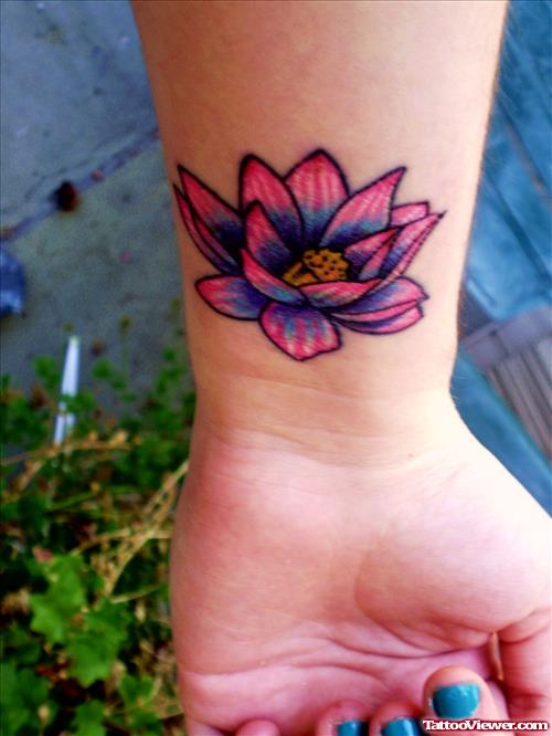 Awesome Colored Flower Tattoo On Left Wrist