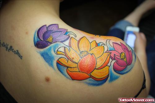 Colored Lotu Flowers Tattoos On Shoulder