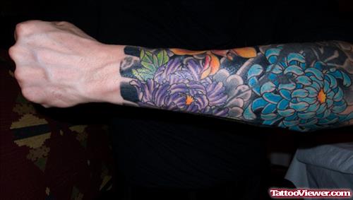 Colored Flower Tattoos On Left Sleeve