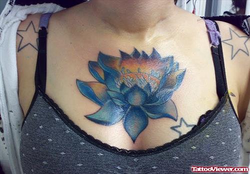 Blue Ink Lotus Flower Tattoo On Chest