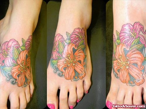 Awesome Colored Flower Tattoo On Girl Left Foot