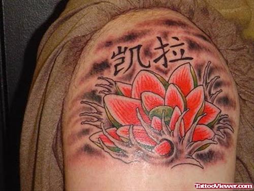 Jaoanese Symbols And Flower Tattoo On Shoulder