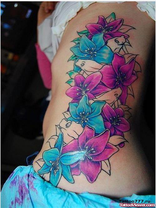 Colored Flowers Tattoos On Rib