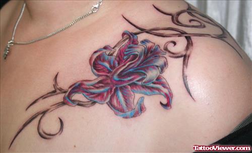 Grey Ink Tribal And Flower Tattoo On Collarbone