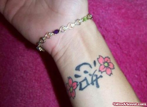 Chinese Symbol And Flowers Tattoos On Wrist
