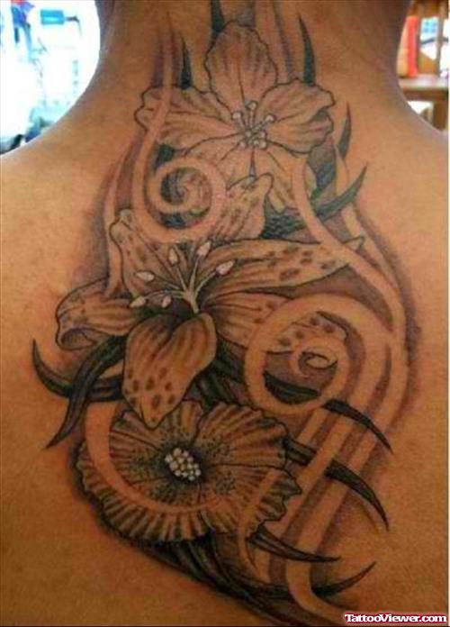 Black Ink Tribal And Grey Flower Tattoos On Back