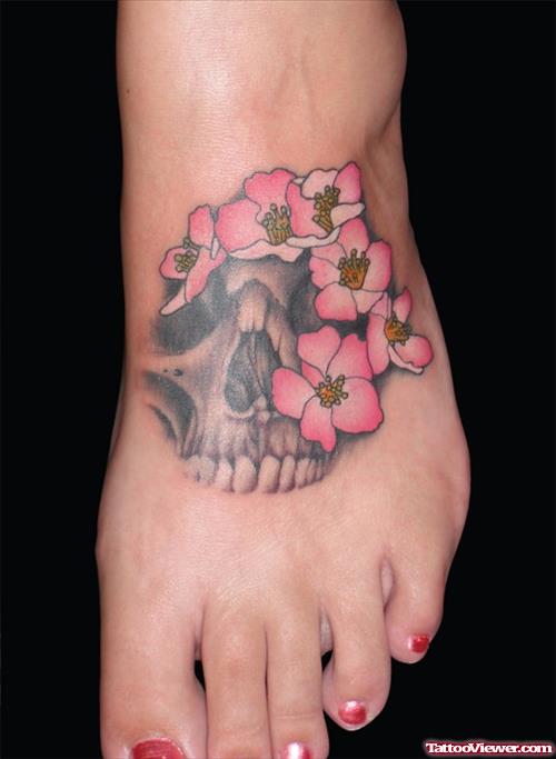 Skull And Flower Tattoos On Left Foot