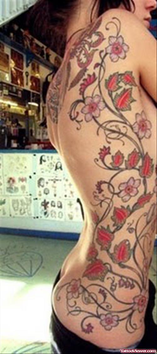 Red Ink Flower Tattoos On Side Rib