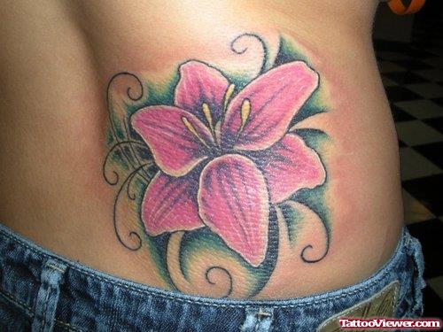 Tribal And Flower Tattoo On Lowerback For Girls