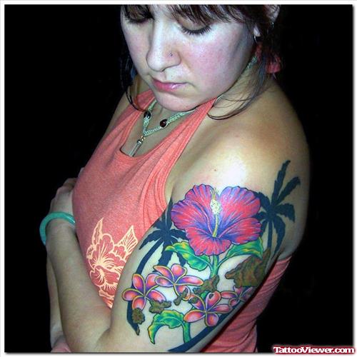Hawaiian Flower Tattoo On Left Half Sleeve