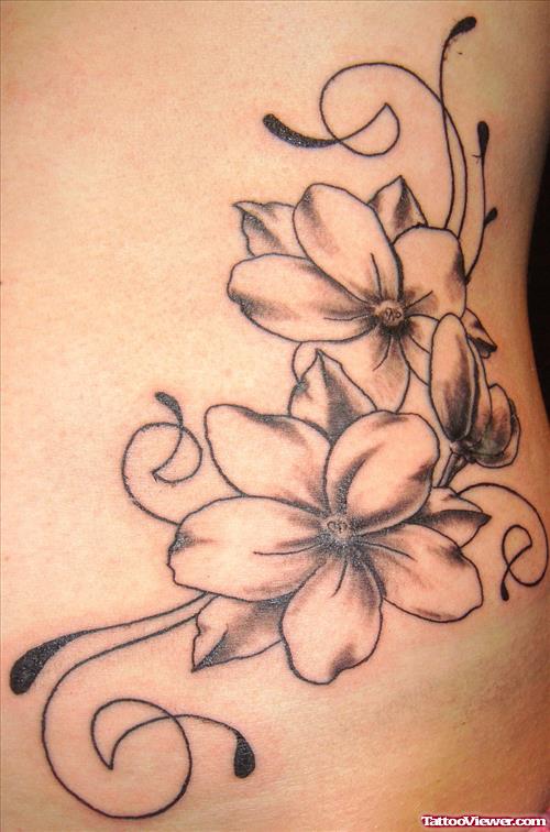 Grey Ink Flowers Tattoos On Side Rib