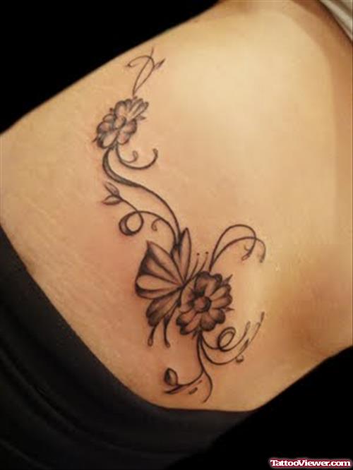 Grey Ink Butterfly and Flower Tattoo