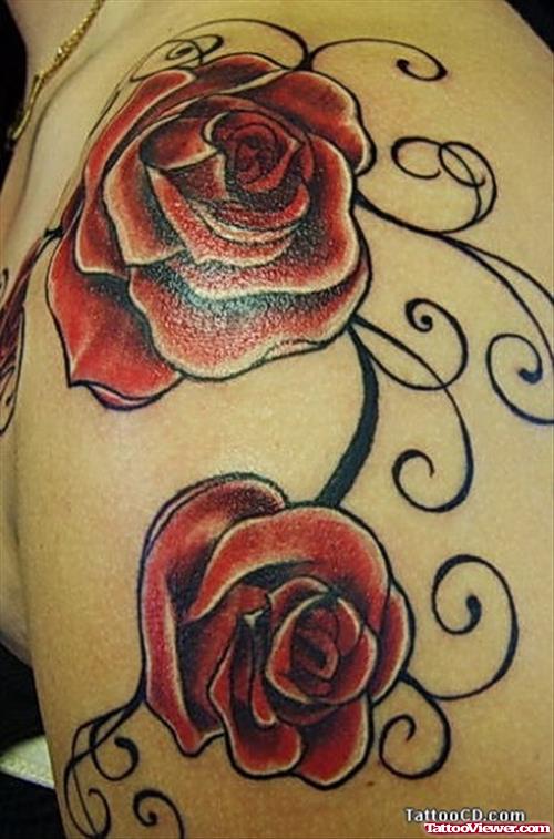 Black Tribal And Red Flowers Tattoo