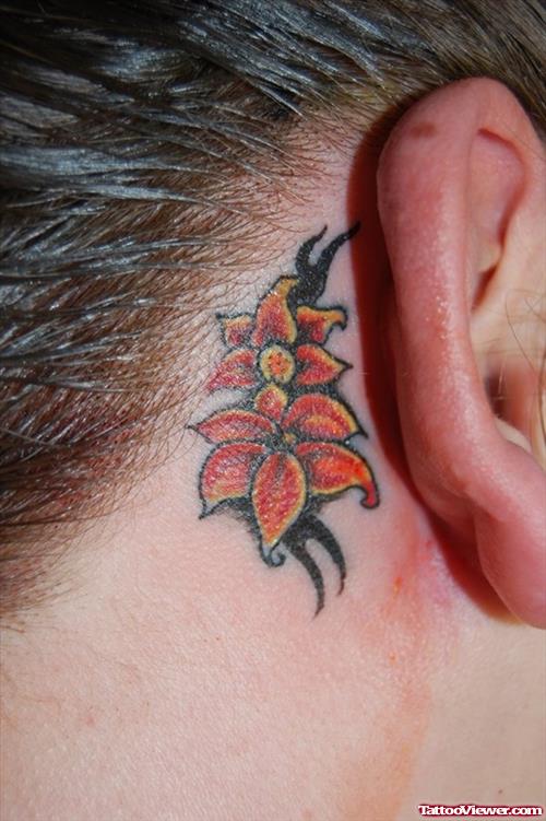 Black Tribal And Flower Tattoos Behind Ear