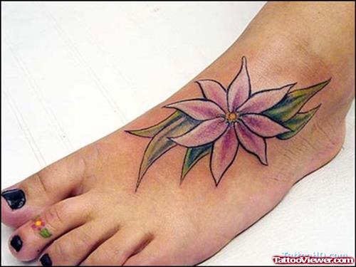 Tribal And Flower Tattoo On Left Foot