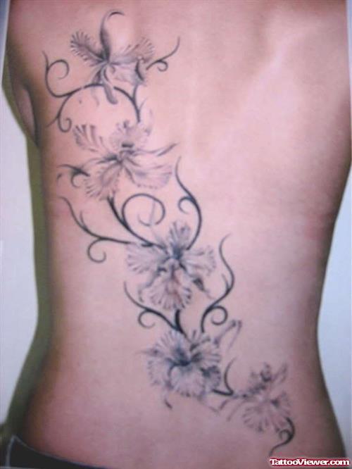 Tribal And Grey Flower Tattoo On Back