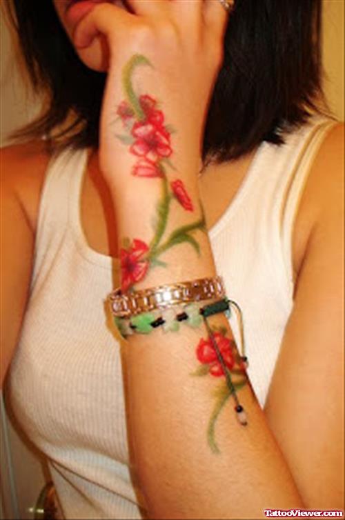 Red Flower Tattoos On Left Arm