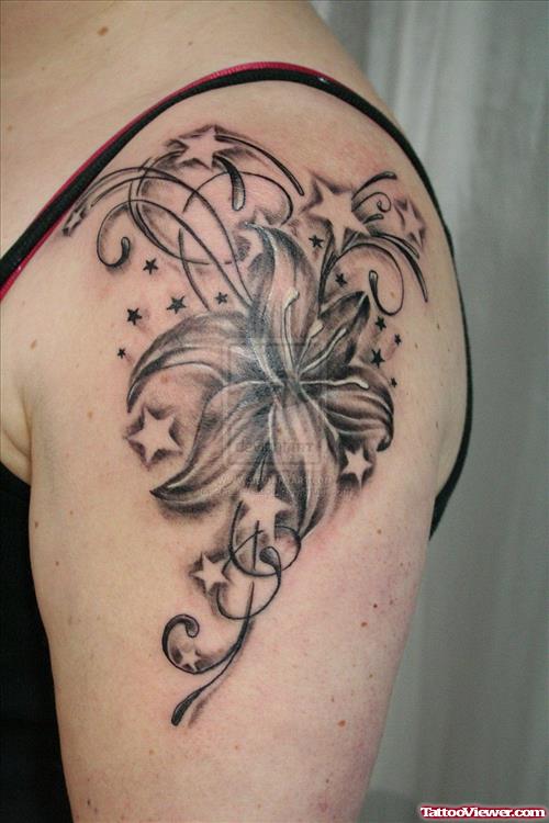 Grey Stars And Flower Tattoo On Left Shoulder