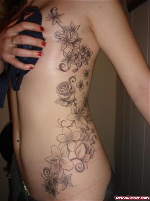 Grey Ink Flowers Tattoos On Girl Rib