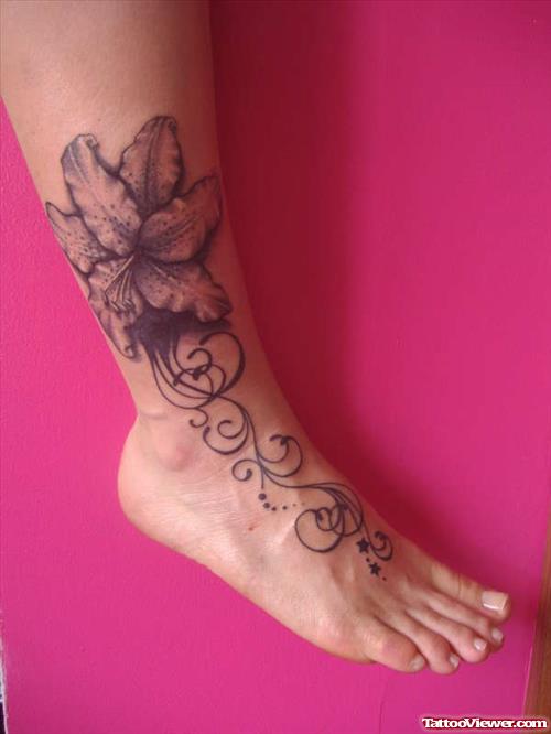 Grey Ink Flower Tattoo On Ankle