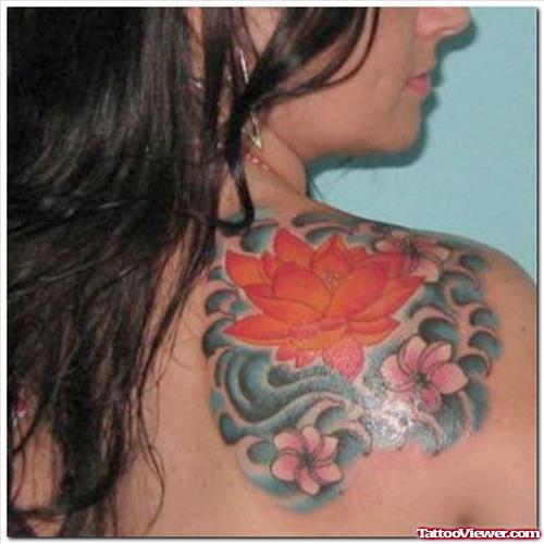 Colored Lotus Flowers Tattoos On Right Back Shoulder