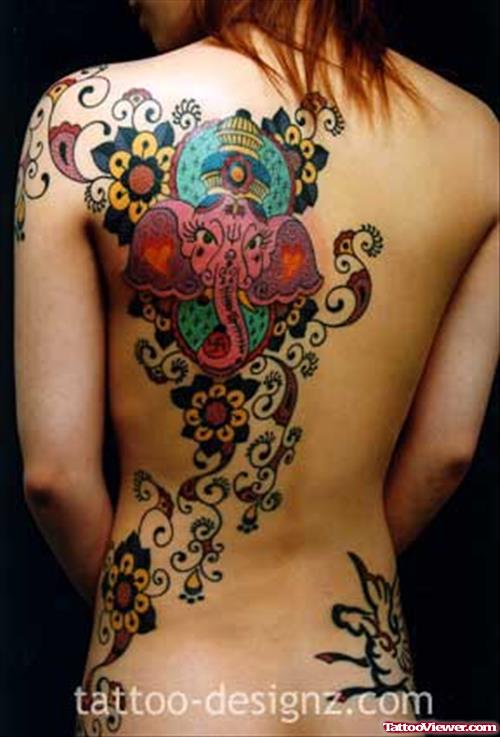 Color Ganesha Head And Flower Tattoos On Back