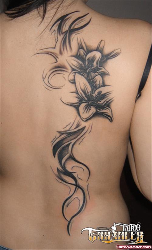 Grey Ink Tribal And Flower Tattoo On Back